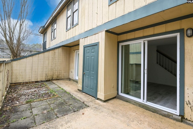 property entrance featuring a patio area