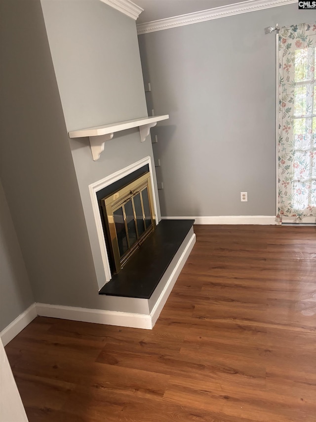 7602 Hunt Club Rd Unit I102, Columbia, SC 29223 - unfurnished living room with ornamental molding, baseboards, wood finished floors, and a glass covered fireplace