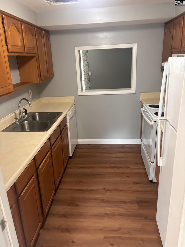 7602 Hunt Club Rd Unit I102, Columbia, SC 29223 - kitchen featuring white appliances, a sink, dark wood-style floors, baseboards, and light countertops