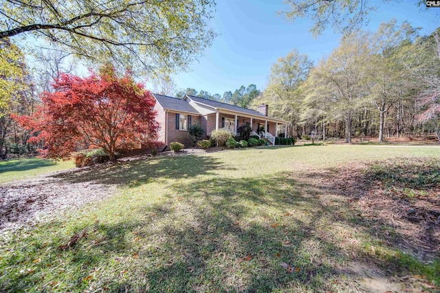 view of yard featuring a porch