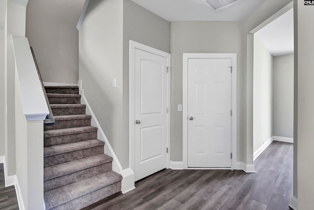 foyer entrance featuring dark hardwood / wood-style floors