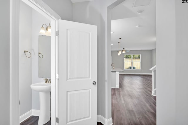 bathroom with hardwood / wood-style floors and ceiling fan