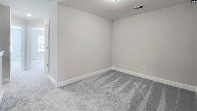 unfurnished room with carpet floors