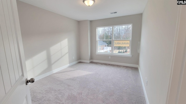 empty room featuring light colored carpet