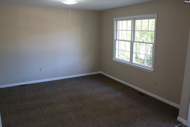 empty room featuring carpet flooring