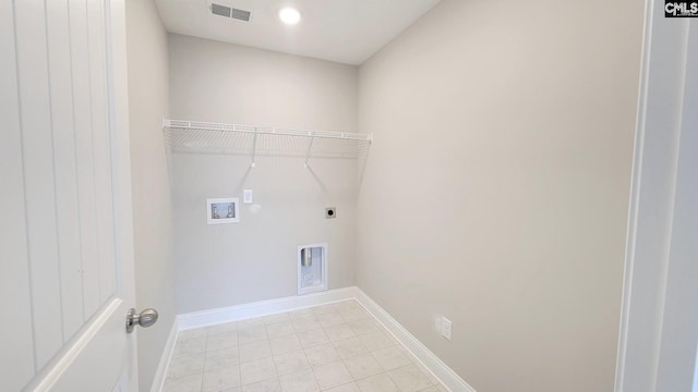 washroom with hookup for a washing machine, light tile patterned floors, and hookup for an electric dryer