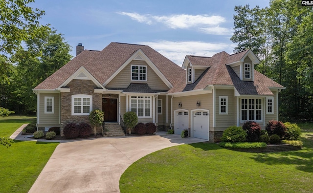 view of front of home with a front yard and a garage