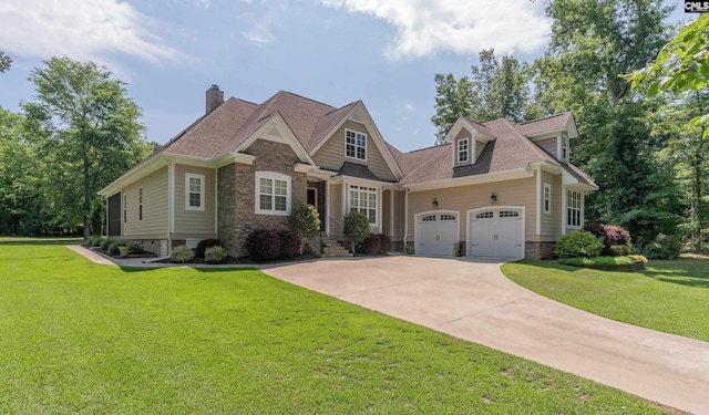 view of front of house featuring a front yard and a garage