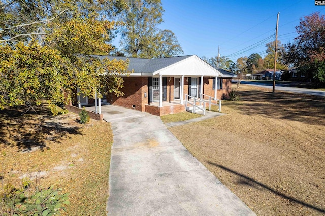 view of front of property with a porch and a carport