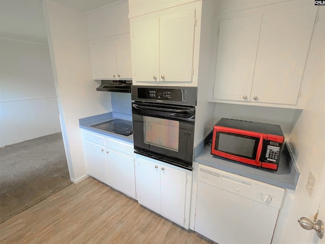 kitchen with white cabinets, black appliances, and light wood-type flooring