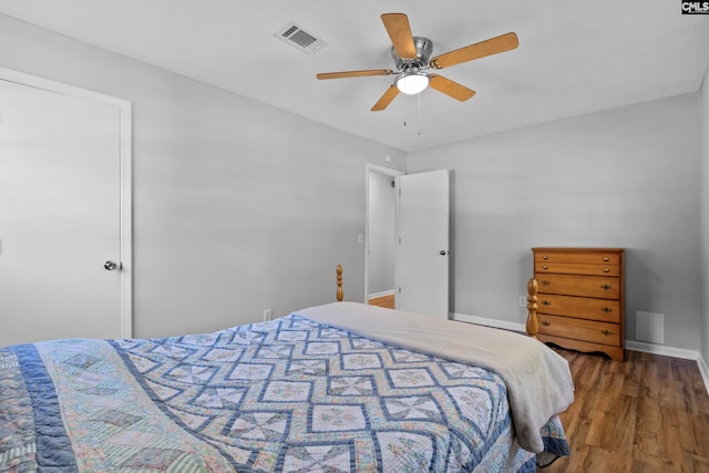 bedroom with wood-type flooring and ceiling fan