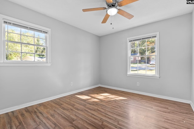 unfurnished room with ceiling fan and wood-type flooring