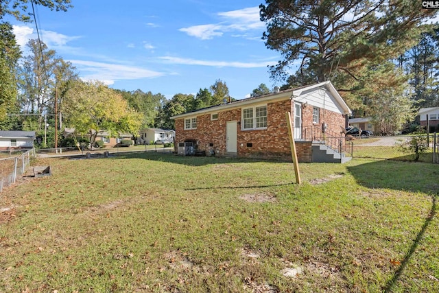 view of property exterior with a lawn