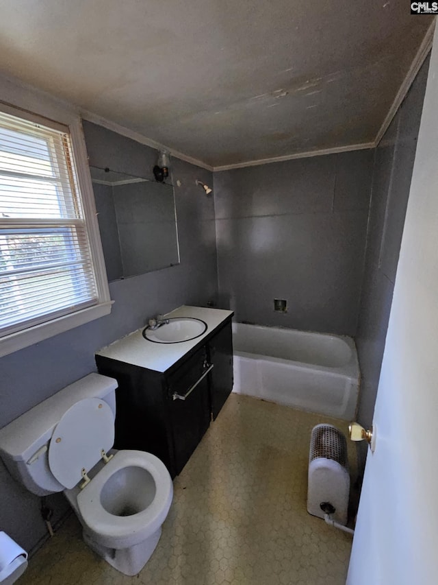 full bathroom with tiled shower / bath, toilet, vanity, and ornamental molding