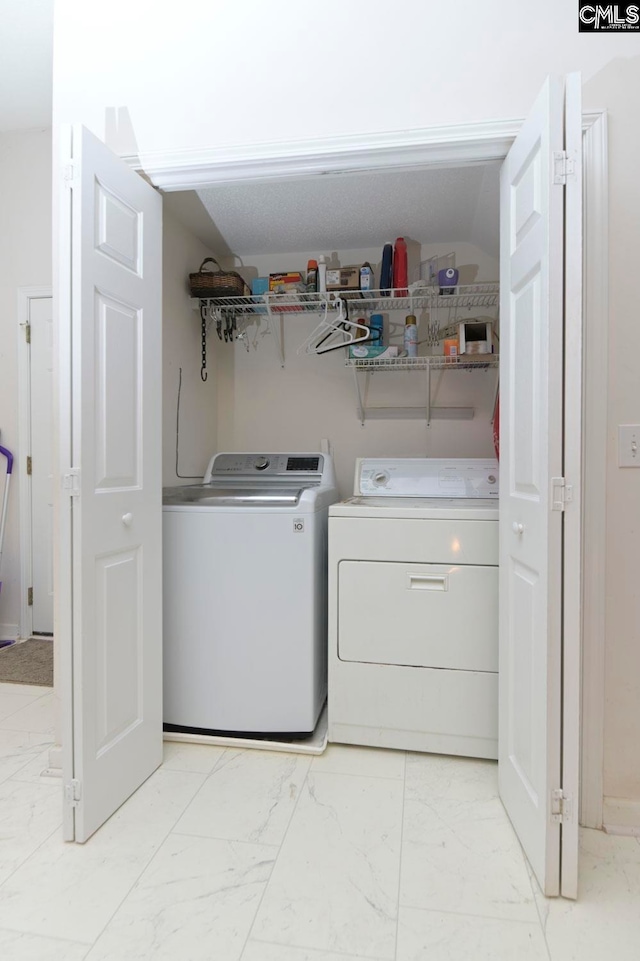 laundry room with independent washer and dryer