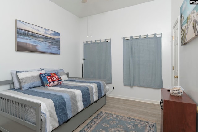 bedroom featuring ceiling fan and dark hardwood / wood-style floors