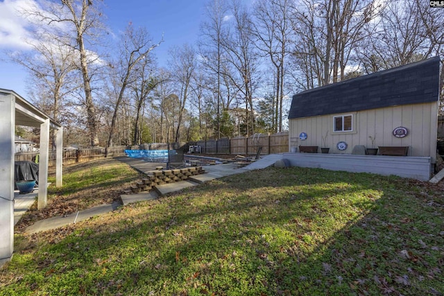 view of yard with a covered pool