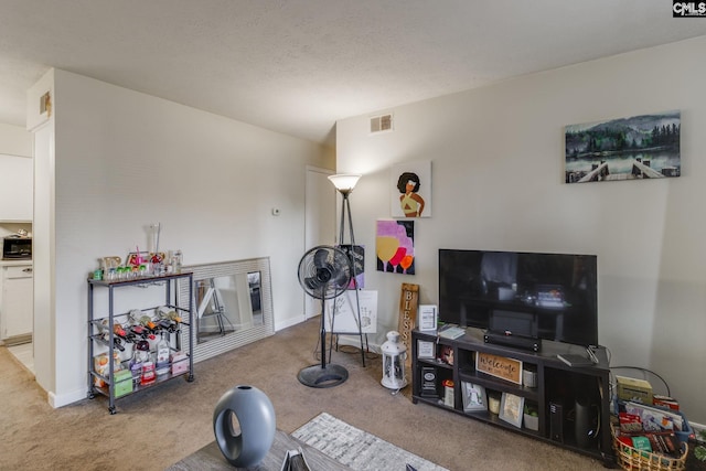 exercise room featuring light carpet