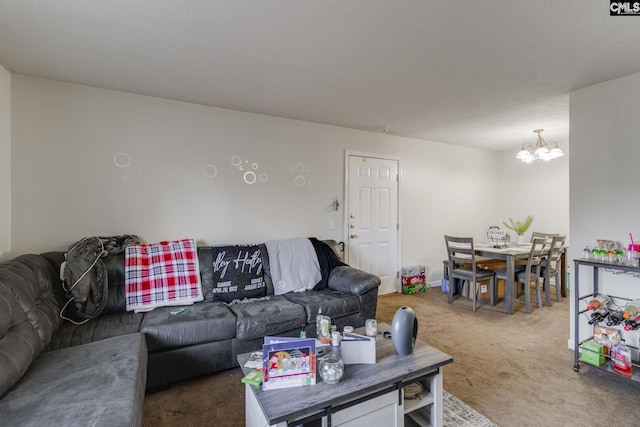 living room with carpet flooring and a notable chandelier