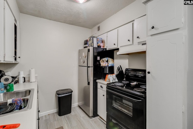 kitchen featuring sink, black range with electric cooktop, a textured ceiling, white cabinets, and light wood-type flooring