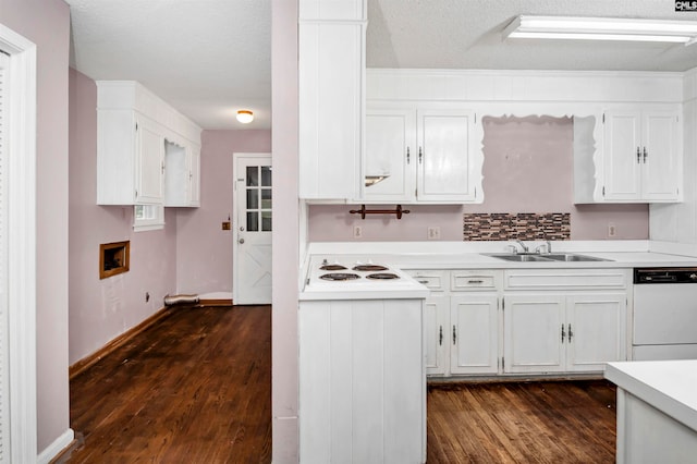 kitchen featuring white cabinetry, sink, dark hardwood / wood-style flooring, a textured ceiling, and white appliances