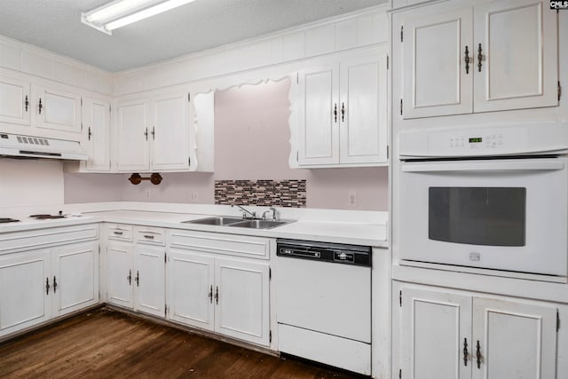 kitchen with white cabinets, white appliances, sink, and exhaust hood