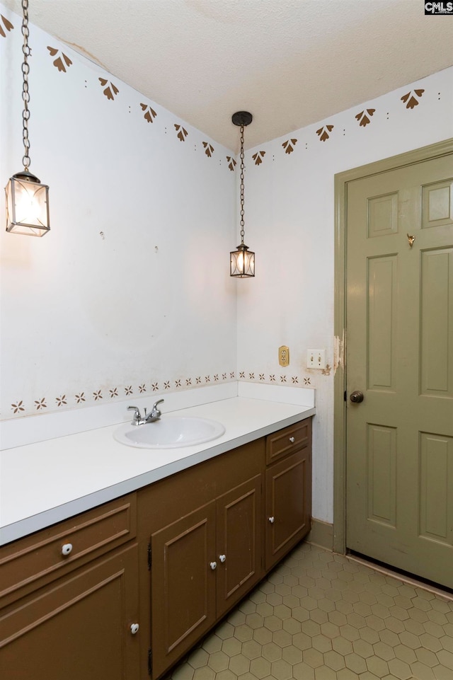 bathroom with tile patterned flooring and vanity