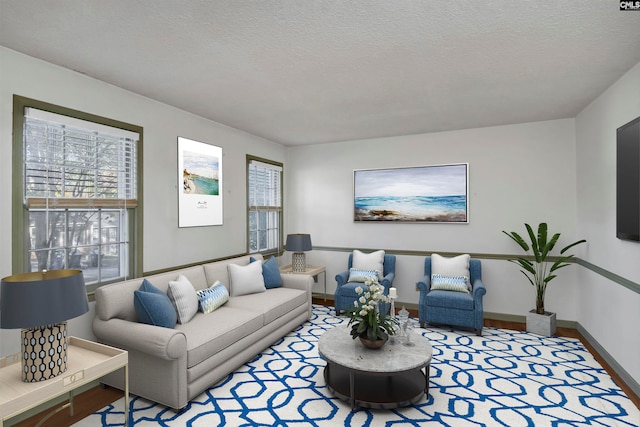 living room with hardwood / wood-style flooring and a textured ceiling