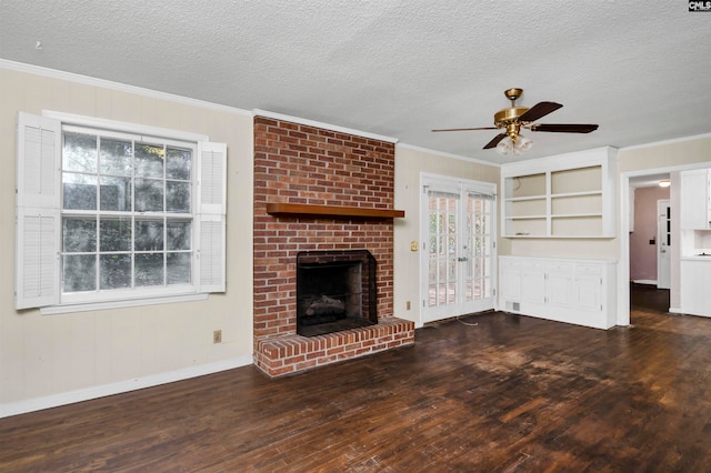 unfurnished living room featuring ceiling fan, french doors, dark wood-type flooring, crown molding, and a textured ceiling