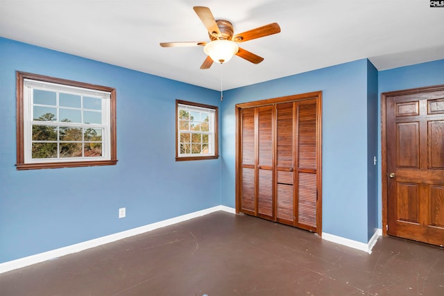 unfurnished bedroom with a closet and ceiling fan