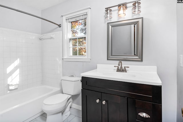 full bathroom with tile patterned floors, vanity, tiled shower / bath combo, and toilet