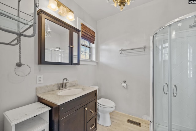 bathroom featuring toilet, vanity, wood-type flooring, and walk in shower