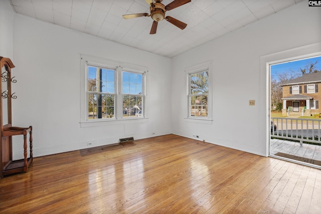 empty room featuring ceiling fan and wood-type flooring