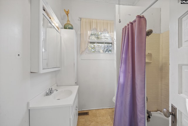 full bathroom featuring toilet, shower / tub combo, vanity, and tile patterned floors