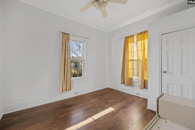 unfurnished room with ceiling fan and dark hardwood / wood-style floors