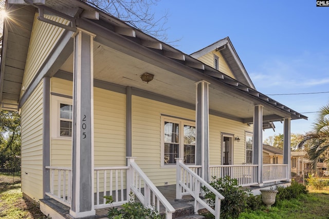 property entrance featuring a porch