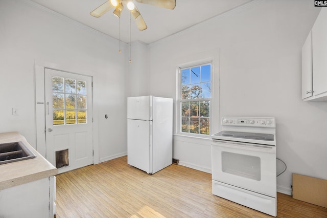 kitchen featuring white cabinets, light wood-type flooring, white appliances, and crown molding