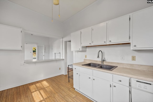 kitchen featuring dishwasher, light hardwood / wood-style floors, white cabinets, and sink