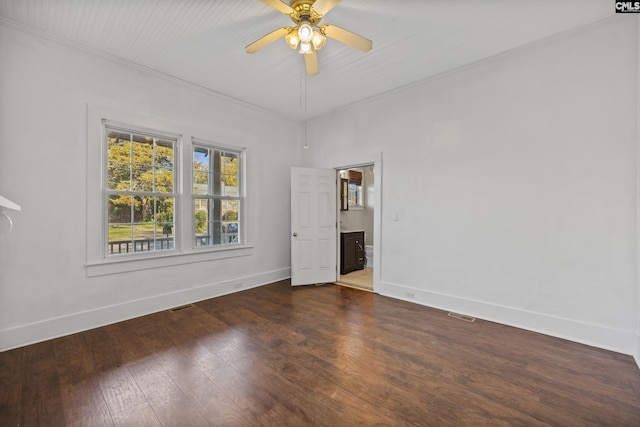 empty room with dark hardwood / wood-style floors, ceiling fan, and ornamental molding