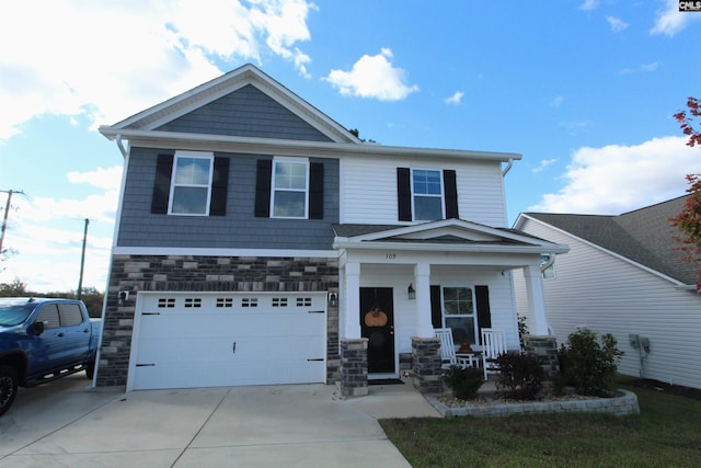 view of front of home with covered porch and a garage