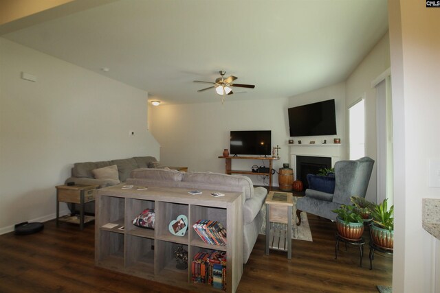 living room with ceiling fan and dark hardwood / wood-style floors