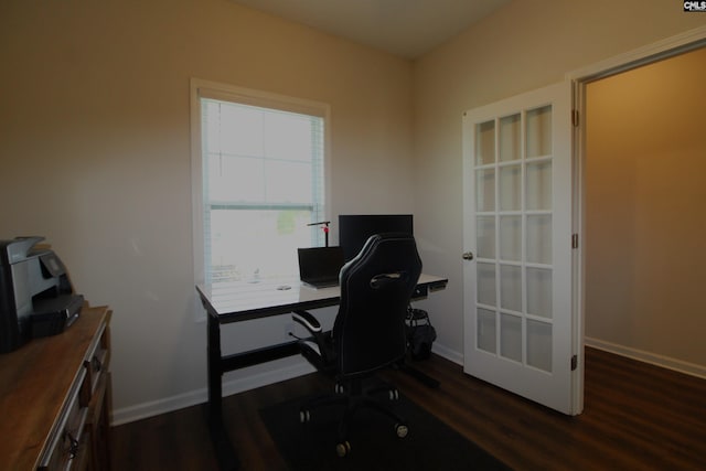 office with a healthy amount of sunlight and dark hardwood / wood-style floors