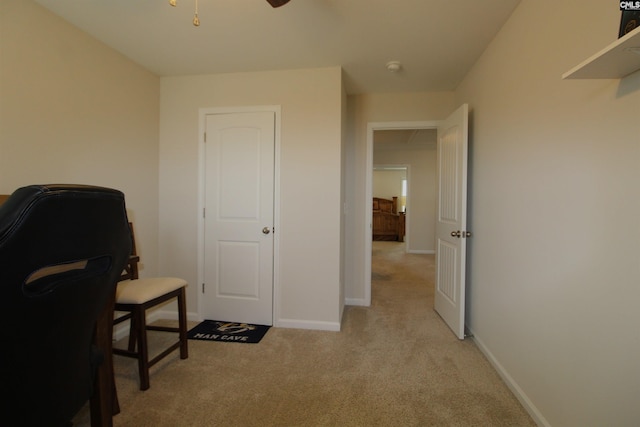 office area with light carpet and ceiling fan