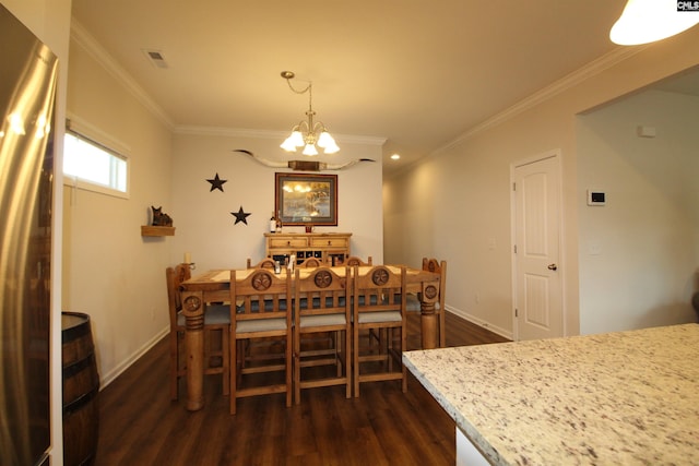 dining area featuring a chandelier, dark wood-type flooring, and ornamental molding