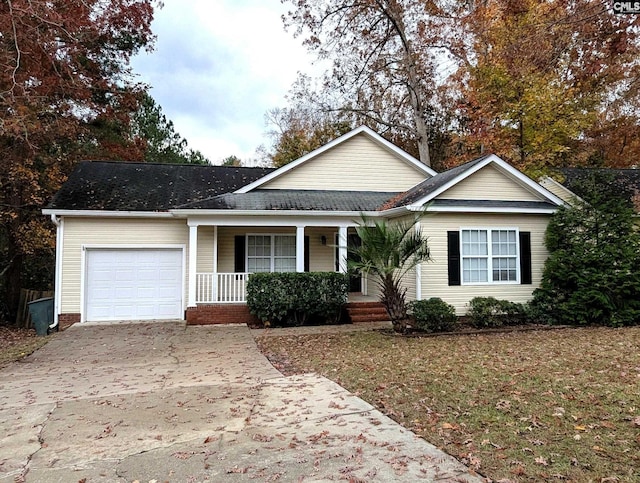 view of front of home featuring covered porch and a garage