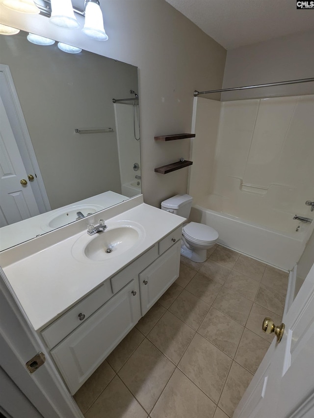 full bathroom with tile patterned floors, vanity, shower / bathtub combination, and toilet