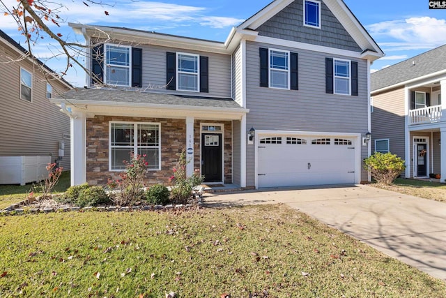 view of front of property with a garage and a front yard