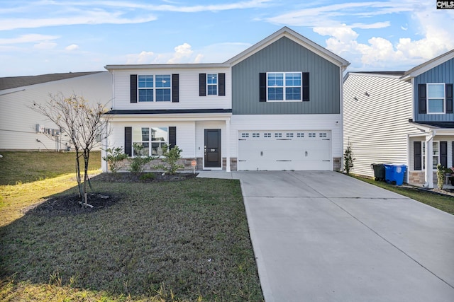 view of front facade featuring a front yard and a garage