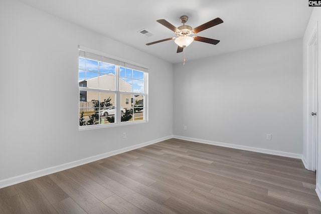 spare room with ceiling fan and light hardwood / wood-style floors