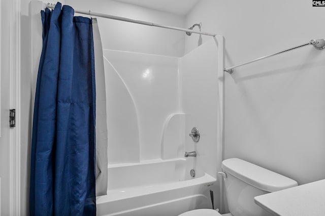 bathroom with shower / bathtub combination with curtain and toilet